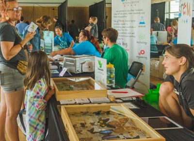 Amateur lepidopterologists make their way to the butterfly booth.