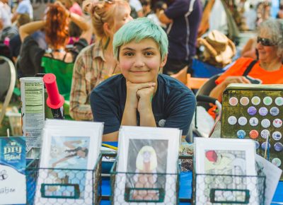 Liv Evans poses with her artwork.