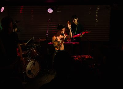 Zauner ditching the guitar and owning the stage with mic in hand.