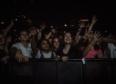 A mesmerized crowd singing back lyrics to the band.