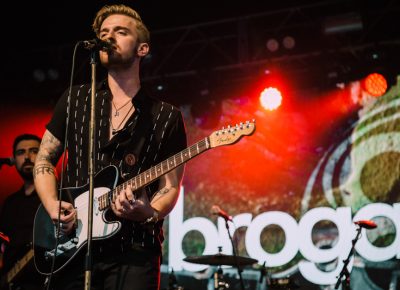 Brogan taking a turn on the guitar.