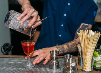 Jacob Hall pours a Sazerac, a traditional cocktail based on cognac. Photo: @clancycoop