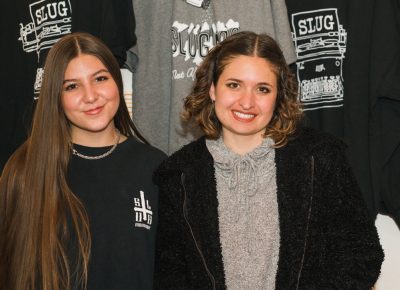 (L-R) Madi and Hilary hold down the SLUG Swag booth in Rye.