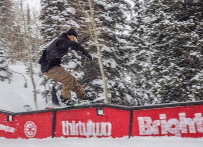 Tail press on a wave rail by Jerome.over the roof.