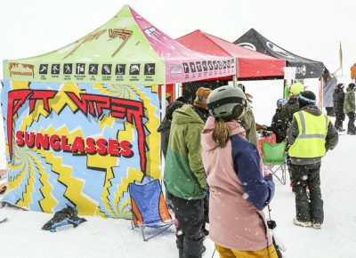 People gather to the sponsor booths despite the snowy weather.