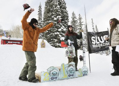 2nd place winner Paxon Alexander of the mens open snow proudly walks up to the podium to join 3rd place winner Evan Thomas.