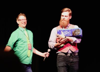 Stage staff showcasing and giving away a 12-Pack of an exclusive early availability for Dr. Pepper's new flavor "Dark Berry". Photo: @Lmsorenson