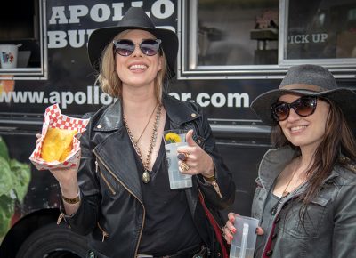 (L-R) Trisha McBride and Anne Knott love the distillery boom happening in Salt Lake right now. “Distillery 36’s Spiced [Brigham] Rum is the most amazing spiced rum I’ve ever had,” McBride said. Knott liked her habañero vodka from Hammer Spring Distillers. Photo: John Barkiple