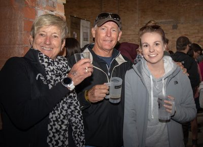 (L-R) Becky, Keith and Jamie Kearns sample beers in Brewstillery’s main space. Keith liked the creaminess of Vernal Brewing Company’s Mama’s Milk Stout Beer. Photo: John Barkiple