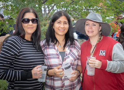 (L-R) Sarah and Starr Soliz and Bethanie Monsen-Ford abandoned John Ford, SLUG Mag’s Community Development Manager, to sample a few beers and spirits. He’s busy making Brewstillery happen, so he’ll have to catch up later. Photo: John Barkiple