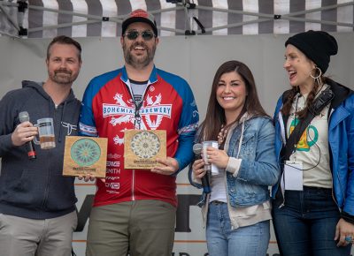 Sylvia and Chris Hollands and Angela H. Brown awarding Kelly Schaefer of Bohemian Brewery with the Best New Brew People's Choice and Best New Brew awards. Photo: John Barkiple