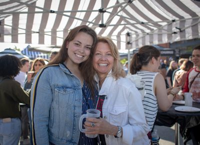 (L-R) Emily and Kathy Durka are still waiting for their Cup Bop bowls, but they don’t mind. Kathy likes the sunshine, the music and the people-watching, Photo: John Barkiple