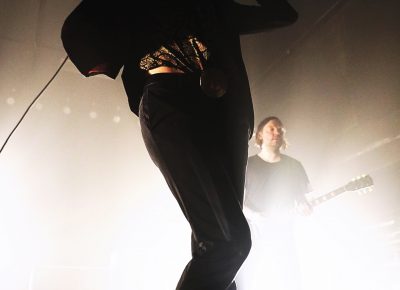 Dennis Lyxzén of Refused, moving around the stage as the music smashes on. Photo: @Lmsorenson