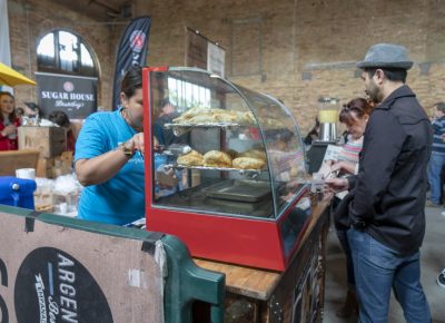 Argentina's Best Empanadas serving a customer. Photo: Jayson Ross