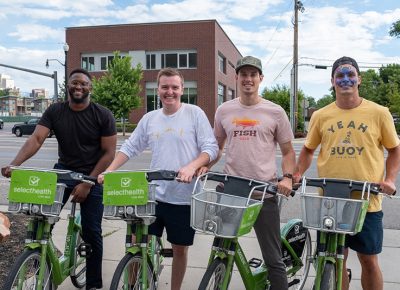 (L–R) Akiode Udonton, Michael Moody, Luke Pyper and Matt Wood grabbed some SLC Green Bikes for the SLUG Cat. Wood wasn’t too shy to "rawr" with that dino on his face. Photo: John Barkiple