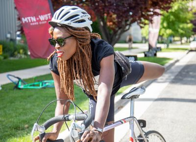 Three-time SLUG Cat champion Nkenna Onwuzuruoha dismounts at Mountain West Hard Cider to earn a stamp on her manifest. Photo: Kaylynn Gonazlez