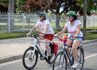 (L–R) Chrissy Upton and Jennifer Ortiz rode in the 2019 SLUG Cat with a group of friends that have been pals for 10 years. Ortiz decorated her bike for the Bike Prom ride from Fairmont Park to Liberty Park. She likes to ride long distances along the Jordan river or on the Legacy Parkway. Photo: Kaylynn Gonazlez