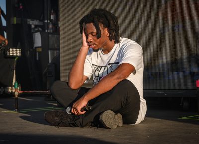 After putting all of his energy into his performance, Denzel Curry collapses in exhaustion. Photo: Colton Marsala