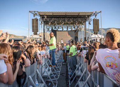 As Denzel Curry performs, the pathway to the stage separates one side of the crowd from the other. Photo: Colton Marsala