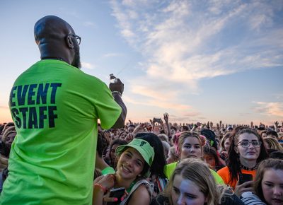 Security monitor and hold back the pulsing crowd as they push to get close to Billie Eilish. Photo: Colton Marsala