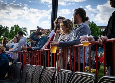 A summer concert is incomplete without cheap beer in plastic cups.