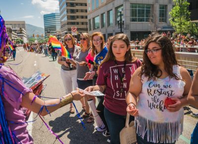 Parade patrons get dished up a fresh batch of SLUG Magazines.