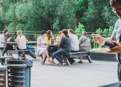 Out on the Traeger patio, Discover Food Festival patrons cozy up on the picnic tables where they enjoy their flavors of Spice Kitchen chefs. Photo: Talyn Sherer