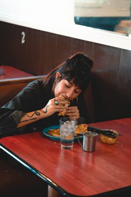 Local artist Alethia Lunares enjoying some pupusas.