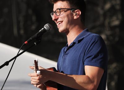 AJR member Ryan on stage playing the Uke at Loveloud.