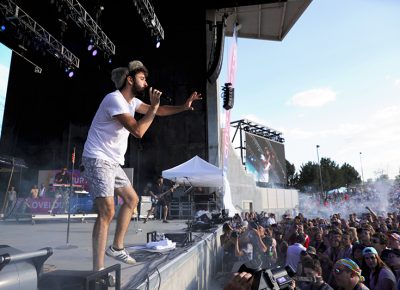 AJR playing on stage at Loveloud.