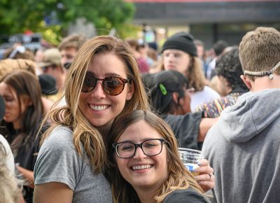 Friends Erin and Gabe are nothing but smiles.