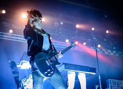 Dave Macklovitch of Canadian electro-funk duo Chromeo enthusiastically sings as he overlooks the masses.