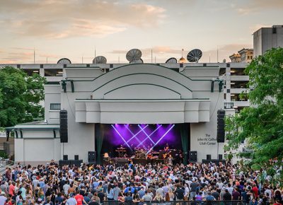 Set against a setting sun, lasers shine through as the Salt Lake City crowd watches headliner Common.