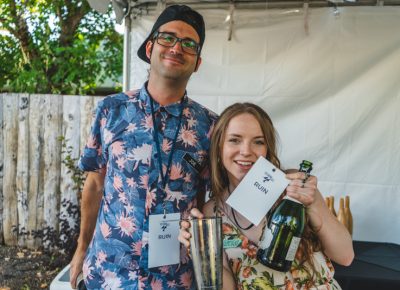 (L–R) Joe Plummer and Kenzie Hunt give us a nice little buzz at the Ruin booth.