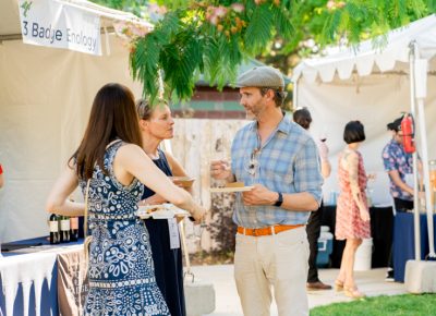 Some patrons enjoy good company under the warm summer sun at Eat Drink SLC.