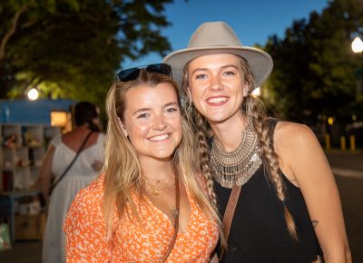 (L-R) Mackenzie Moran and Abbie Hoekstra stroll by the Dreamers Building after a look at Copperhive Vintage’s trailer full of retro treasures.