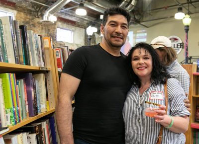 (L–R) Juan Pablo and Jewel Story enjoyed the 90th anniversary celebration, but they also returned for the after hours after party for past and present employees. Story worked at Sam Weller Books from 1995–2001.