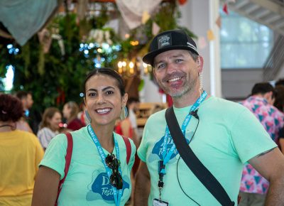 (L-R) Tara Olson and John Ford tour the Dreamers Building. An open spot gave them a chance to move Craft Lake City’s merch table inside the building.