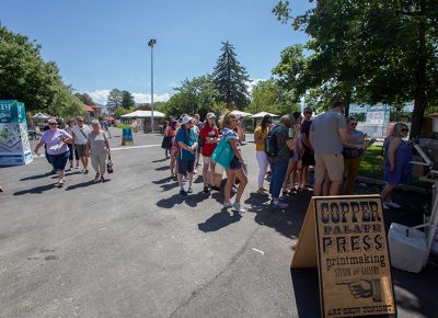 A long line awaits Copper Palate Press totem bag printing.