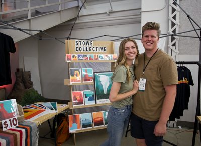 Stowe Collective smiles at their awesome booth.