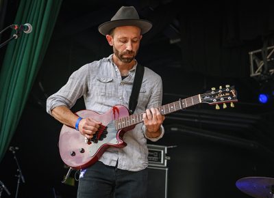 The Hollering Pines’ guitarist, M. Horton Smith, hears a who as he performs at Thursday’s Twilight Concert.