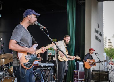 The Canadian-based group Foxwarren serenades the crowd with their beat-heavy indie rock.