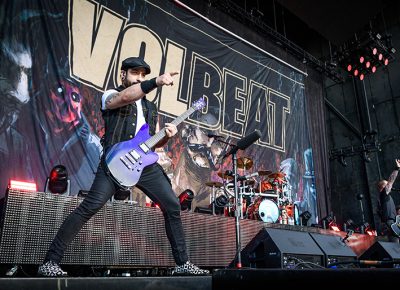 Volbeat guitarist Rob Caggiano points out over the crowd as he slays his six string.