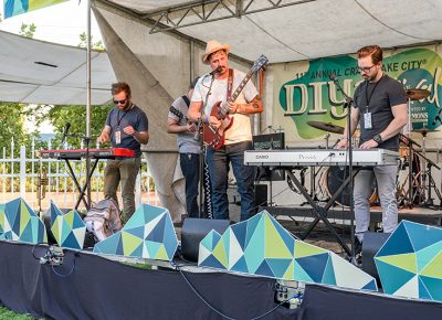 Kasadoom jamming in the summer sun at the KRCL Stage.