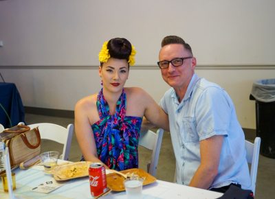 A couple of attendees enjoying the food in the Harmons VIP Area.