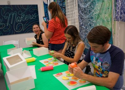 Participants in the Cookie Decoration Workshop putting in some work on the cookies.