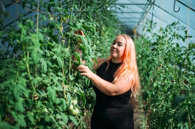 Frog Bench Farm Manager Stacy Semborski picking through the product