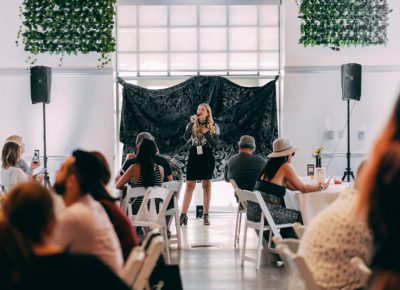 Over in the VIP Lounge, we are treated to a lovely vocal performance while we sip craft cocktails and dine on catered food.