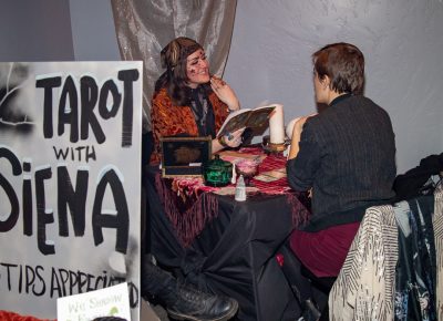 (L–R) Tarot diviner Siena reads Julia Maier’s cards. The take-away? “Trust yourself,” Maier said.