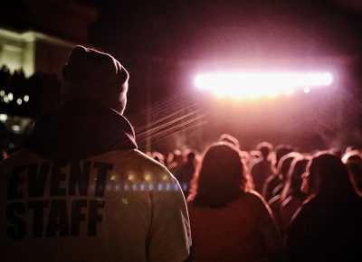 Event security standing amongst the crowd.